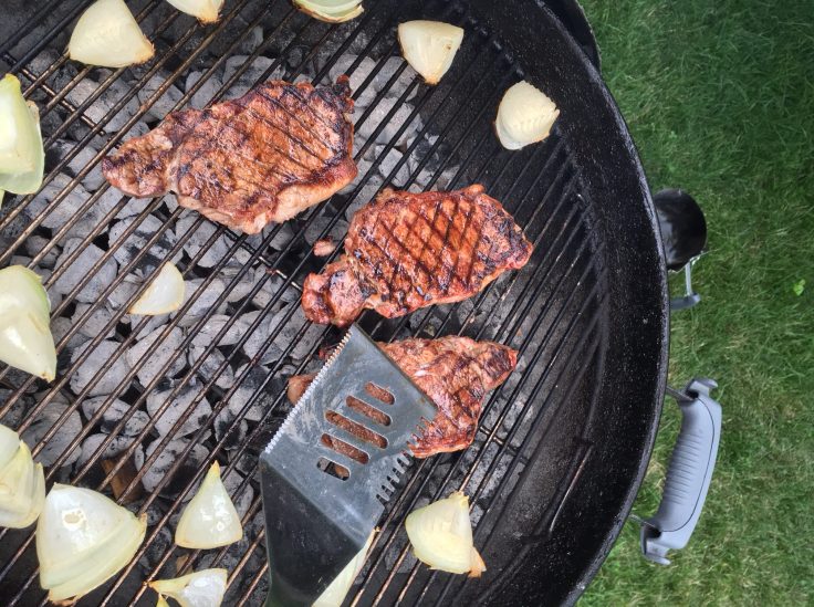 Testing Steak Doneness on Charcoal Grill